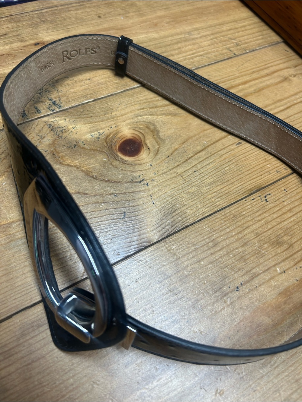 Rolfs Embossed patent leather belt. Size small adjustable versatile styling